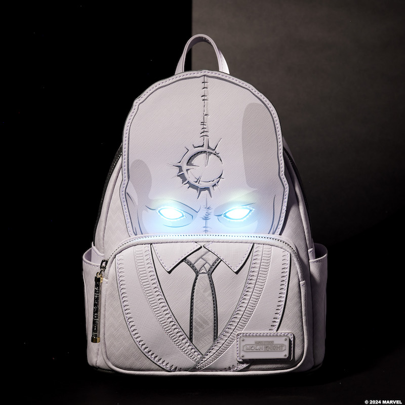 White Loungefly Limited Edition Marvel Moon Knight Mr. Knight mini backpack featuring Mr. Knight in appliqué details with textured details of his suit on the front pocket, sitting against a dark background with his eyes lit up. 